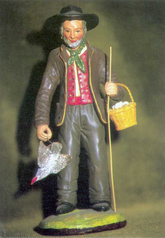 Salon des santonniers : l'Homme à la poule (santon
                traditionnel)